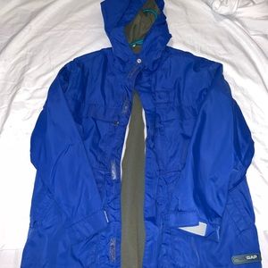 A blue athletic boys coat